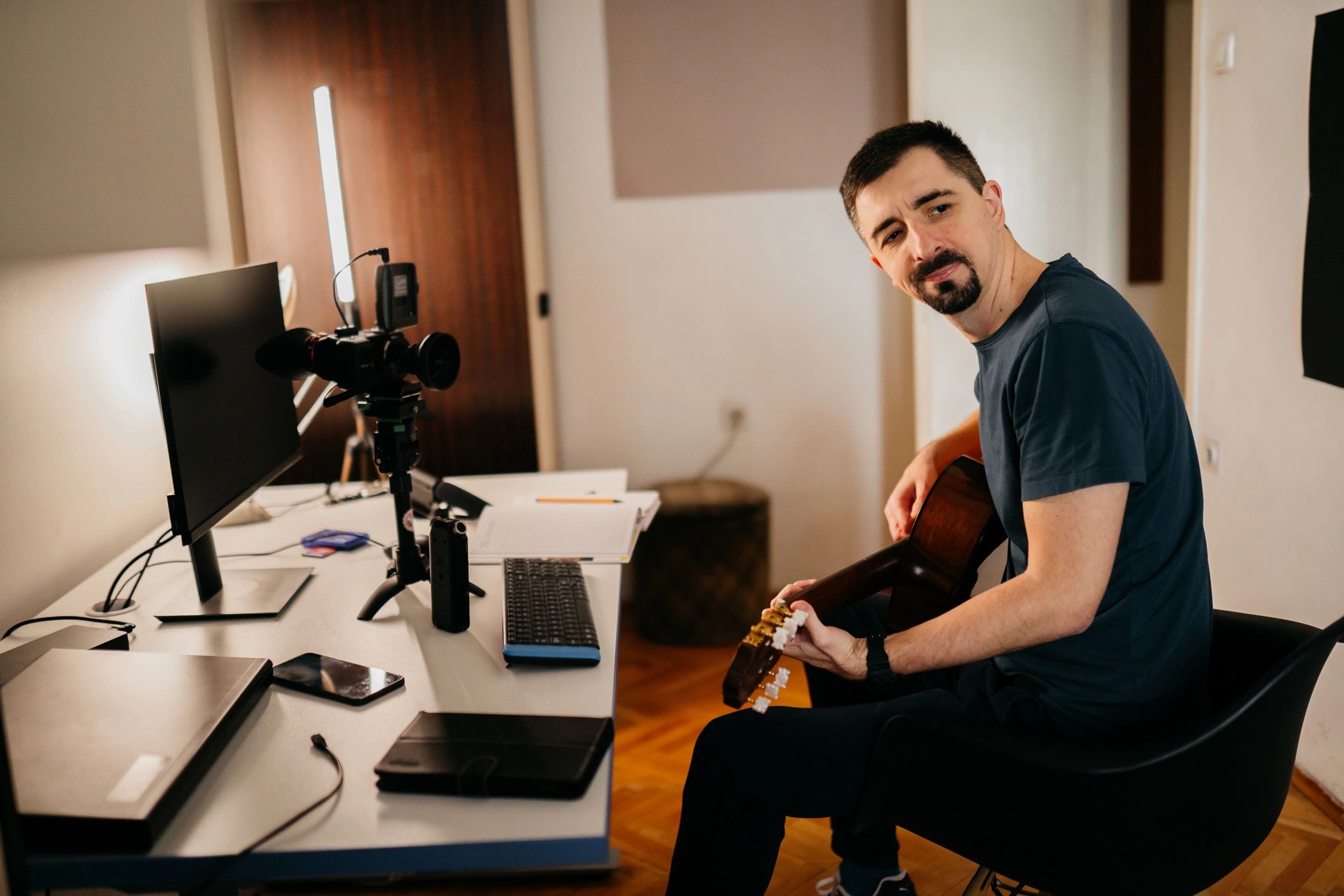 Musician with guitar in a recording session